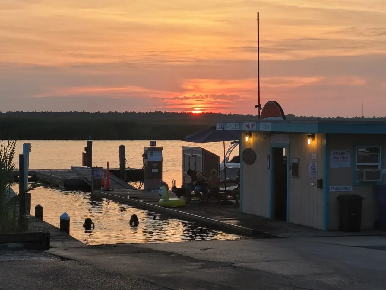 Snack shack and fuel dock at sunset at Shady River Marina